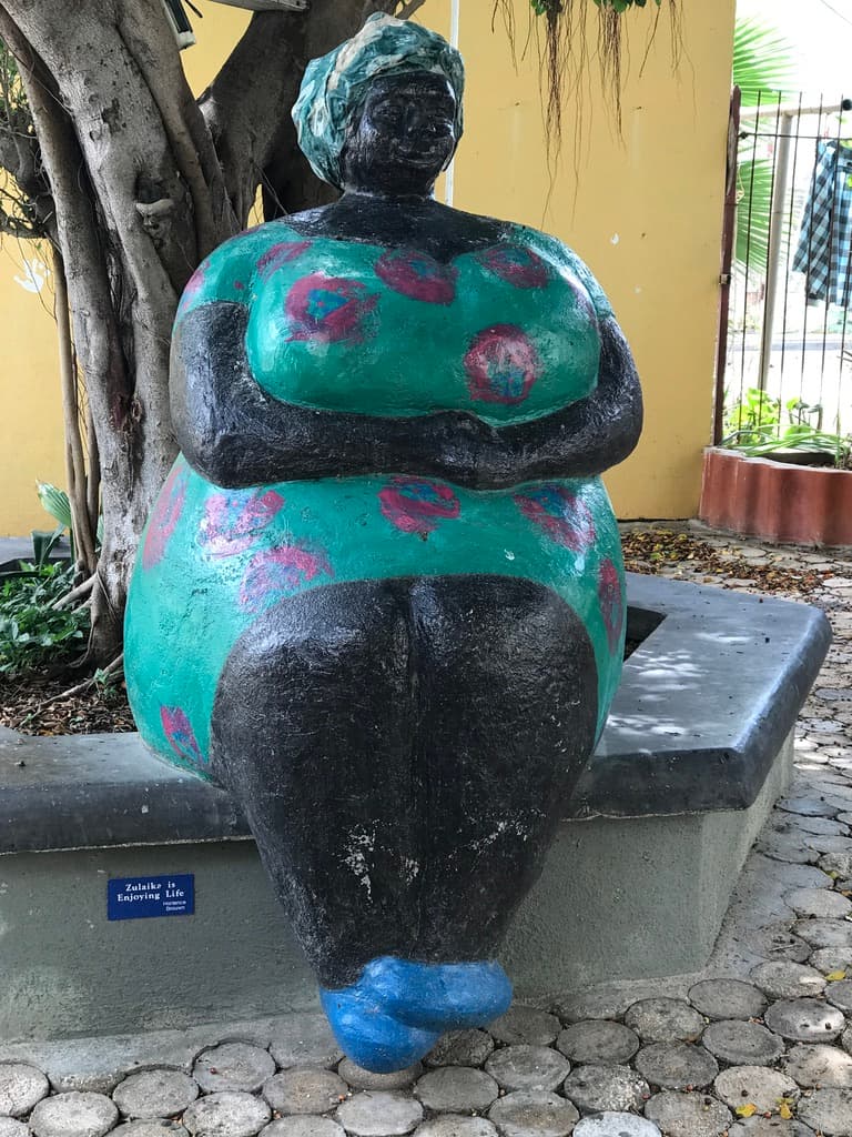 Zulaika is Enjoying Life — a painted sculpture in Willemstad's old city, the kind of detail that makes Curaçao above water as interesting as below