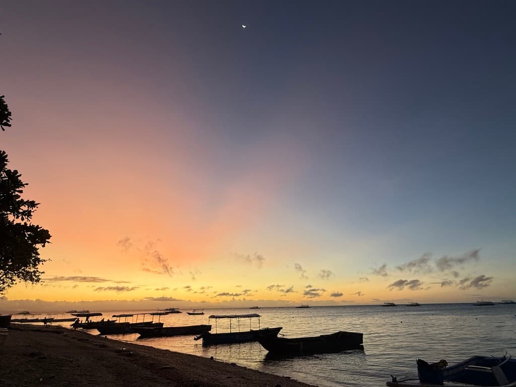 Pre-dawn at a dive beach — the stillness before descent