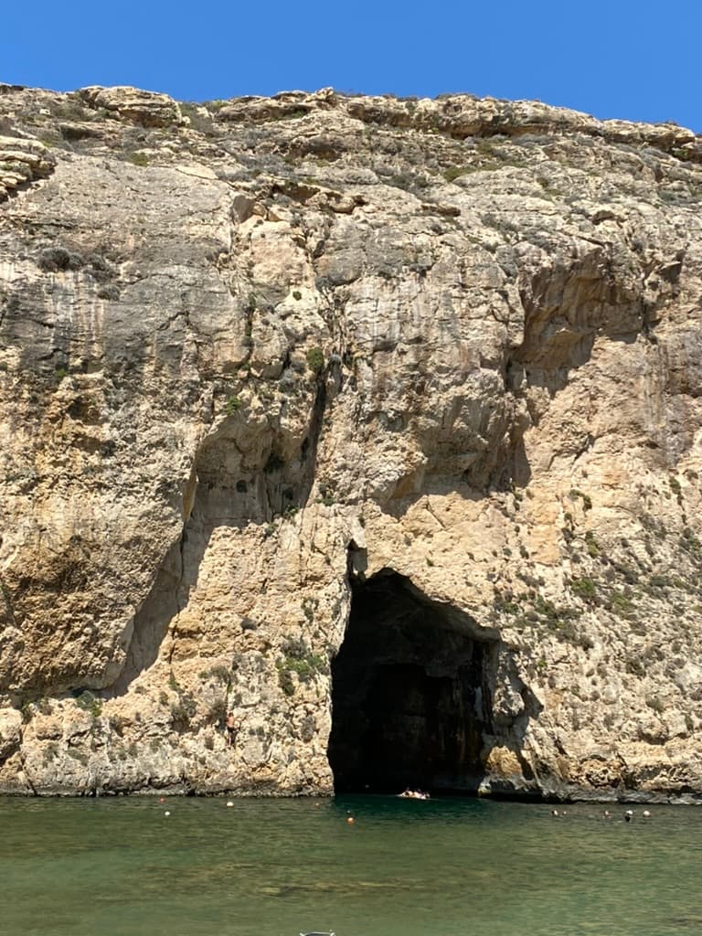 The Inland Sea tunnel entrance from the water — divers swim through this opening into the lagoon beyond