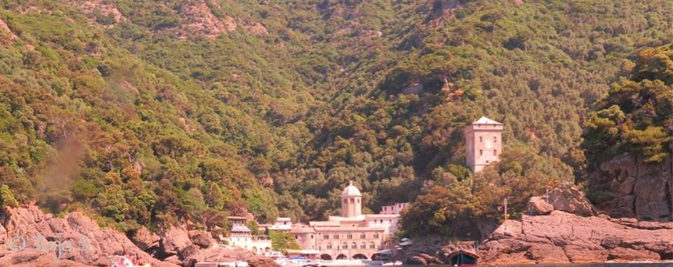 San Fruttuoso from the water — the abbey, the tower, the approach by sea that is the only way in