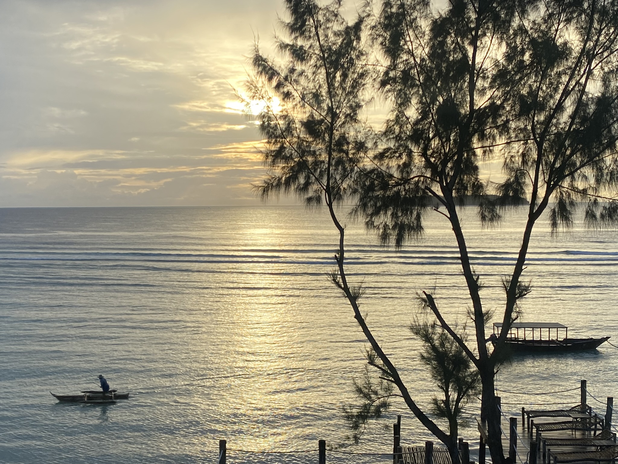 Sunrise departure — dhow heading out to Mnemba Atoll